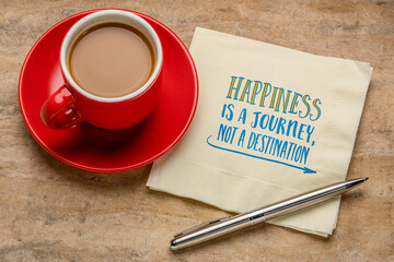 Happiness is a journey, not a destination, inspirational note - handwriting on a napkin with a cup of coffee, personal development concept