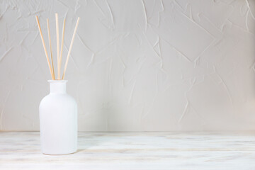 Aromatic reed diffuser on a white background - obrazy, fototapety, plakaty