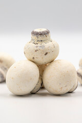 Fototapeta premium Mushroom chocolate isolated on white background. Close-up. Mushroom-shaped coated chocolate dragee