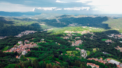 Fototapeta na wymiar Aerial view of The Alpine foothills in Piedmont region, northwestern Italy. Green hills in the Italian Alps.