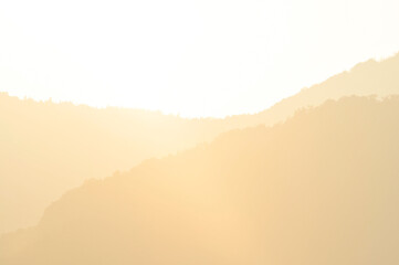 clouds over the mountains in sunset