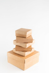 On a white background, many cardboard boxes are placed according to size.