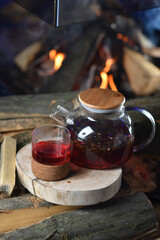 Fototapeta na wymiar Pomegranate tea in a glass teapot 