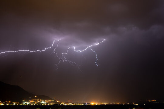 Textured night sky with bright lightning. Global warming