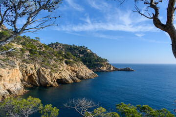 Naklejka premium Cliffs with caves in Tossa de Mar, Catalonia