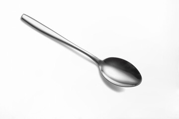 The metal shiny spoon isolated on white