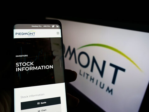 Stuttgart, Germany - 02-26-2022: Person Holding Cellphone With Website Of US Mining Company Piedmont Lithium Inc. On Screen In Front Of Logo. Focus On Center Of Phone Display.