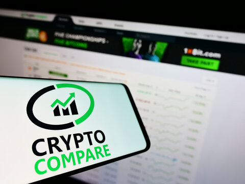 Stuttgart, Germany - 02-26-2022: Smartphone with logo of British financial company CryptoCompare on screen in front of business website. Focus on center of phone display.