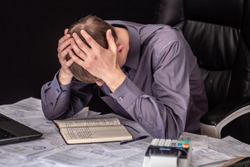 A man with receipts and invoices.Crisis, slump.Insolvent debt obligations on loans among the...