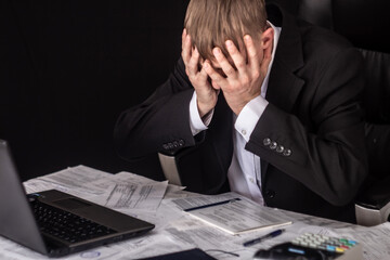 A man with receipts and invoices.Crisis, slump.Insolvent debt obligations on loans among the...