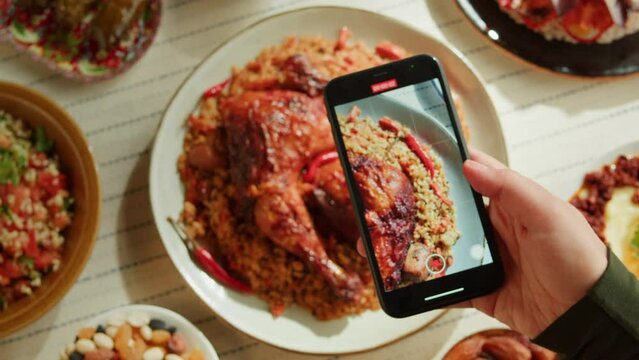 Kabsa Top View, Taking Photo Of Rice And Meat Dish On Smartphone, Saudi Arabia National Traditional Food. Muslim Family Dinner, Ramadan, Iftar. Arabian Cuisine. Religious Holiday, Holy Month.