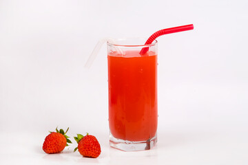 Strawberry juice in a glass with a straw on a white background. Strawberry smoothie. Milk strawberry cocktail. Cold summer drink.