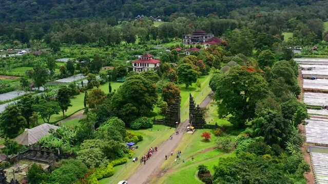 aerial of tourists taking photos at the famous Handara gate in Bali Indonesia during a sunny morning