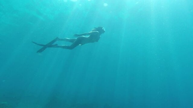 Woman swimming in the ocean. Woman swimming in the ocean.