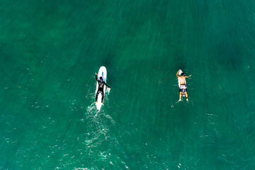 Haifa / Israel - Nov 7 2020 Aerial view of a surfer  surfer paddles to the line-up