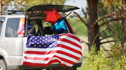 American flag on the car. Independence Day concept. USA holiday.