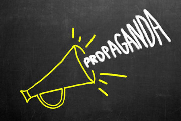 Propaganda and fake news concept. The word propaganda comes out of a megaphone. Misinformation and counterinformation concept.