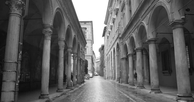 Black and white view of famous and historic Unesco world heritage site of Porticoes of Bologna in Bologna, Italy.