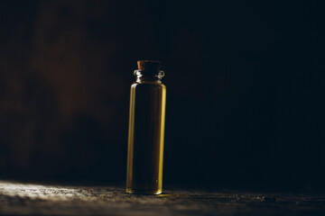 Wooden table. Oil bottle. Oil. Spa concept. Vial. Bottle. 
