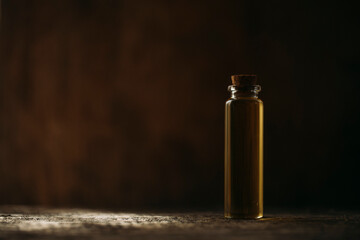 Obraz na płótnie Canvas Oil bottle. Herbal. Shadow. Glass.