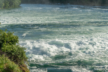 Fast currents in Rhine Falls in spring.