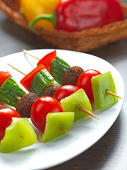 a mixed vegetable souvlaki made of red and green pepper,cherry tomato,mushroom and cucumber - 510064295