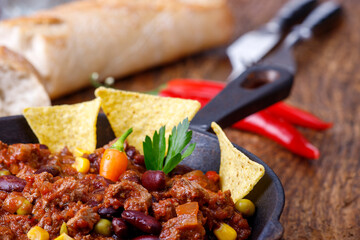 chili con carne on wood