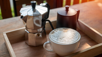 closeup cup of coffee and coffee brewing equipment