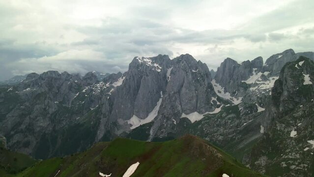 Aerial slider shot of ridge between Albania and Montenegro. Karanfil mountain group in the distance