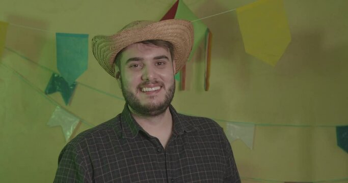 Man wearing typical clothes for Festa Junina. Feast of Arrai&aacute; de S&atilde;o Jo&atilde;o. Close-up photo smiling.