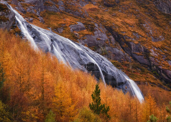 Spectacular Gleninchaquin waterfall in autumn forest park