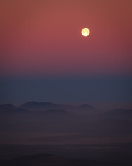 Amazing night scape with a moon with mountains