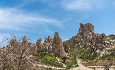 Fototapeta na wymiar Uchisar castle, walking road and pigeon valley in Cappadocia, Nevsehir, Turkey. Travel destination.