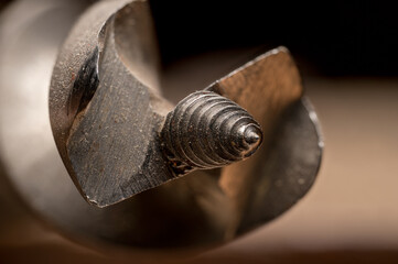 Macro close up of vintage woodworking drill bit, threaded bit