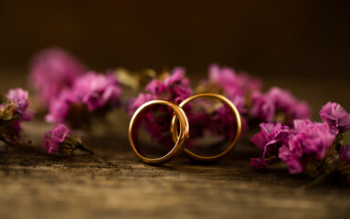 wedding rings and flowers