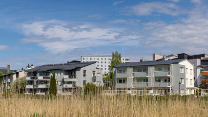 Fototapeta na wymiar Green environmental residential district in Helsinki on a bright summer day