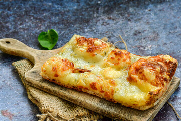   Italian  Focaccia  four cheese with crispy crust   Full 72 hour pizza dough   fermentation   method. Roman style pizza slice 