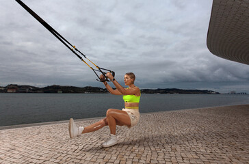 trx outdoor workout. Idea for social networks. Download high resolution photos.
