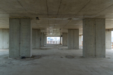 An apartment building under construction. Construction process, walls, partitions. Building frame