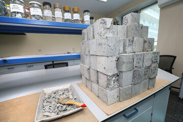 Modern laboratory for testing road samples and materials concept. Cement concrete samples for testing. - obrazy, fototapety, plakaty