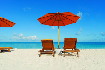  Two Chairs And Parasol With In The white Beach