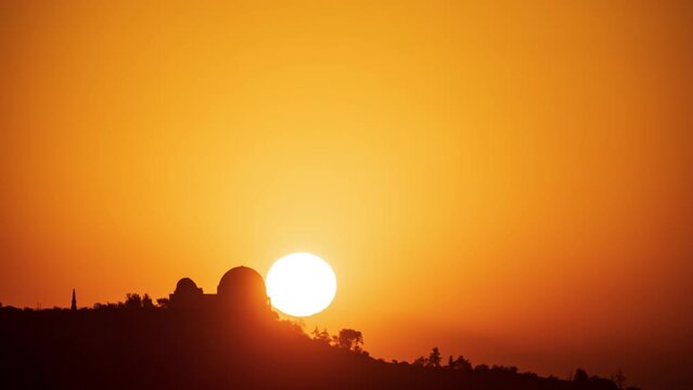 Time Lapse of the sun rising behind Griffith Observatory in Los Angeles.