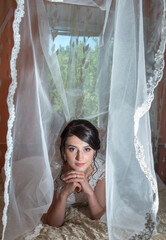 The bride at the wedding under the veil.