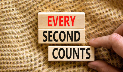 Every second counts symbol. Concept words Every second counts on wooden blocks on a beautiful...