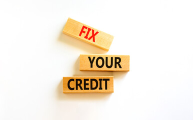 Fix your credit symbol. Concept words Fix your credit on wooden blocks on a beautiful white table white background. Business, finacial and fix your credit concept. Copy space.