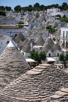 Street scene from the famous little town of Alberobello, one of the most touristic cities in Italy