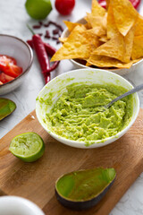Making avocado guacamole dip and chips cooking food
