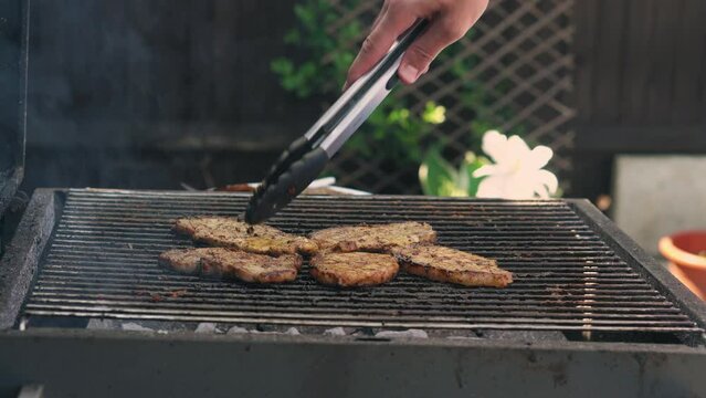 Spicy Pork Beef Bacon Being Grilled Over Bright Glowing Coals Broasting On Fire. Lunch celebration Party Barbecue. Outdoor Cooking. Cook Prepares Oriental Dish In Kitchen. Junk Food, Healthy Lifestyle