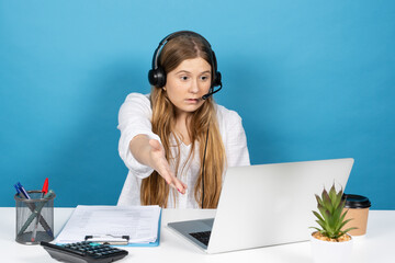 Virtual assistance worker having video call and giving indications. Telemarketing operator sitting behind desk isolated on blue background.