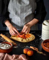Food photography of apricot pie, galette, cake, preparatio, human hands